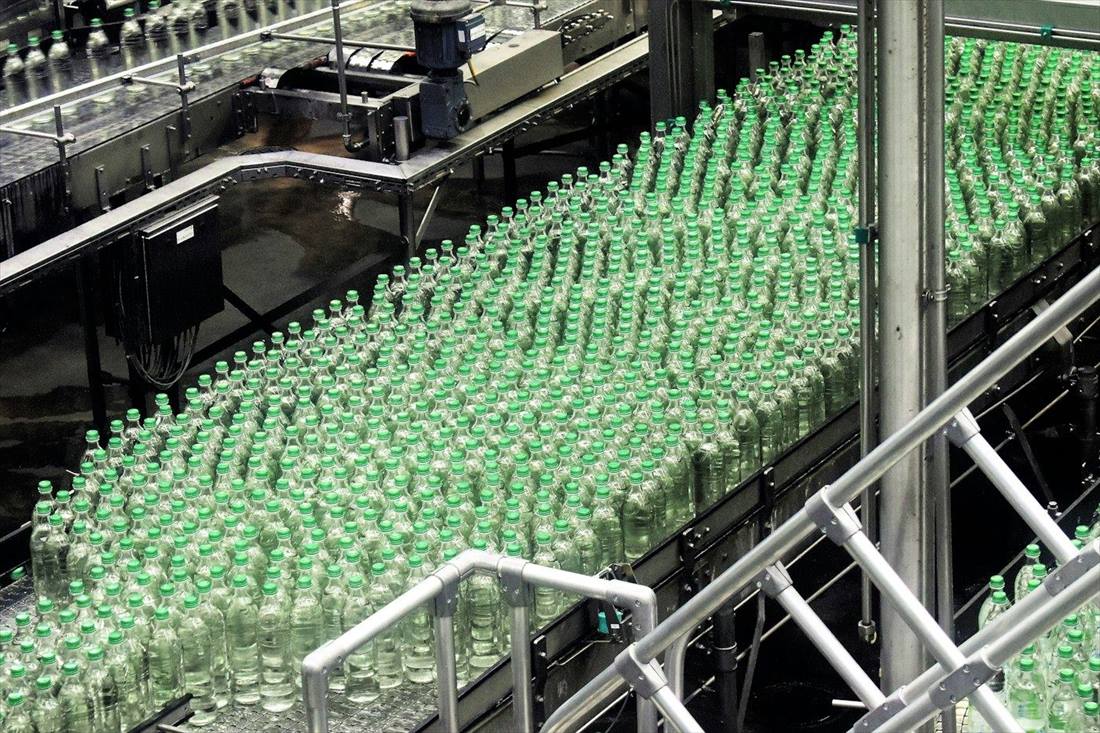 Glass bottles moving along a production line